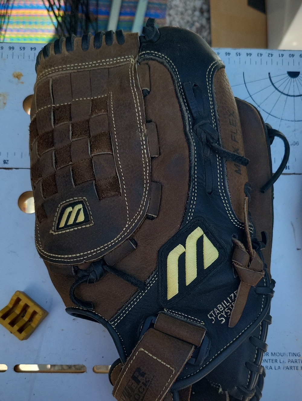 Marucci Brown & Black Youth Baseball Glove with Yellow Logo
